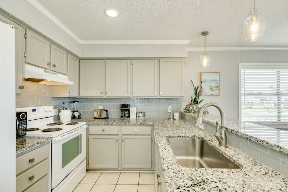 Fully equipped kitchen with abundant storage and counter space