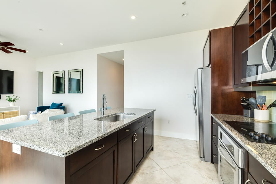 Large kitchen island has plenty of space to prep or serve homecooked meals