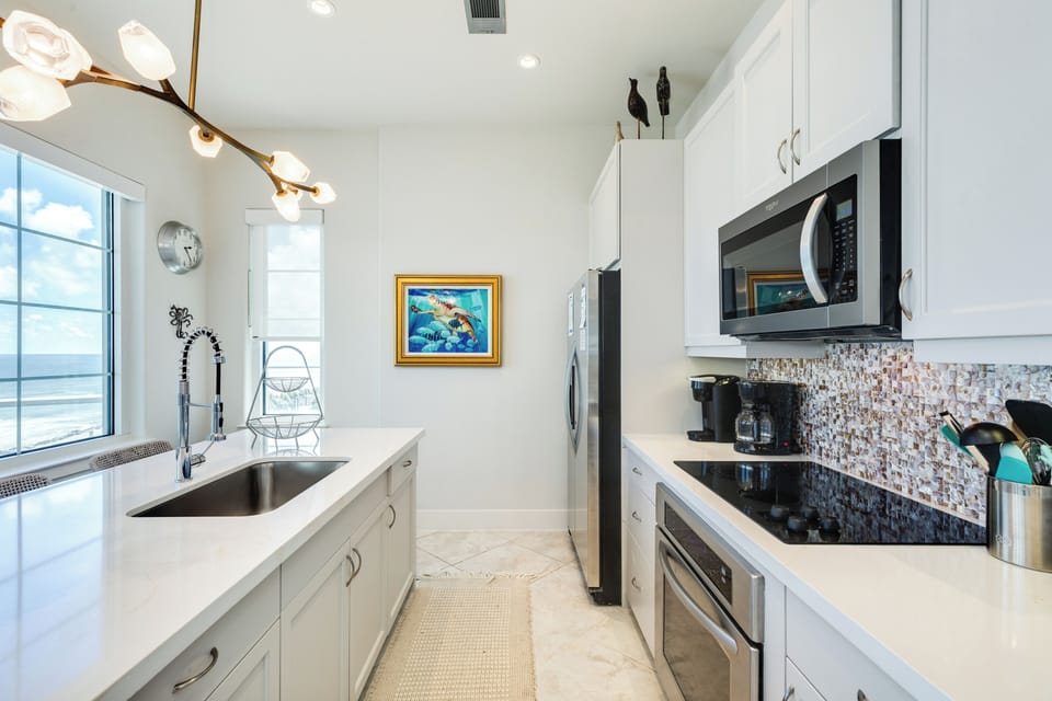 Fully equipped kitchen with stainless steel appliances makes prepping food at home easy