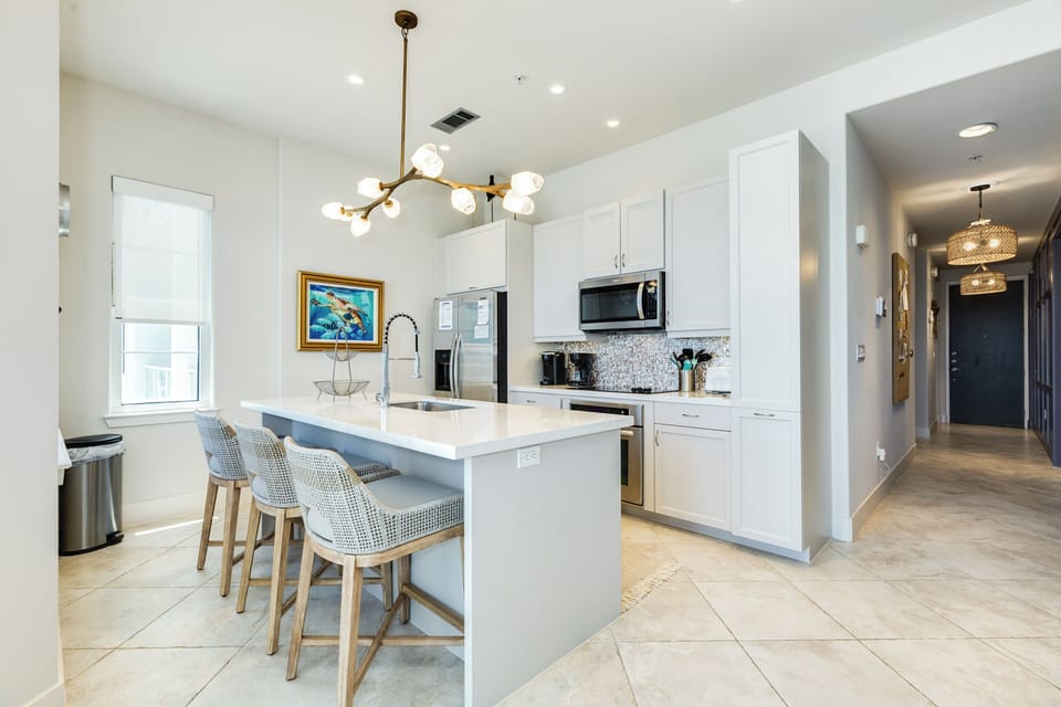 Serve food or enjoy a snack at the large breakfast bar with seating for 3