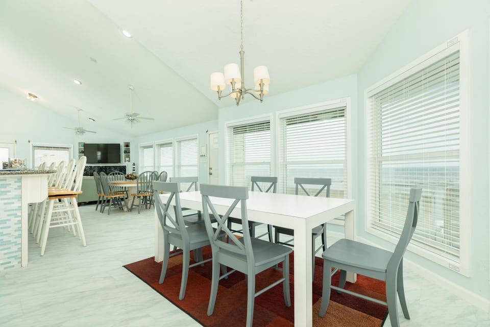 Enjoy meals overlooking the Gulf from two dining tables - sure to fit the whole group!