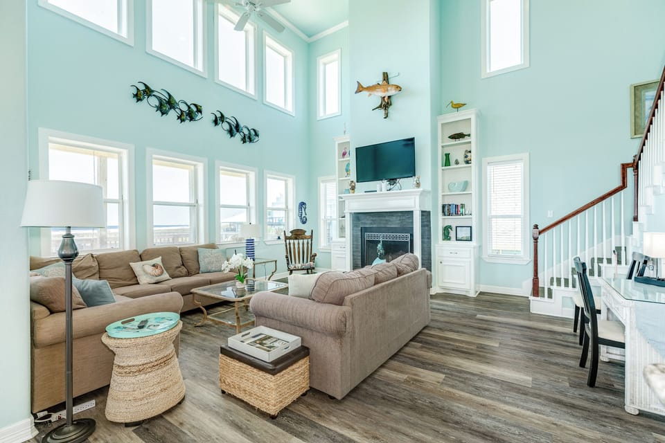 Wall of windows in the bright and airy living room