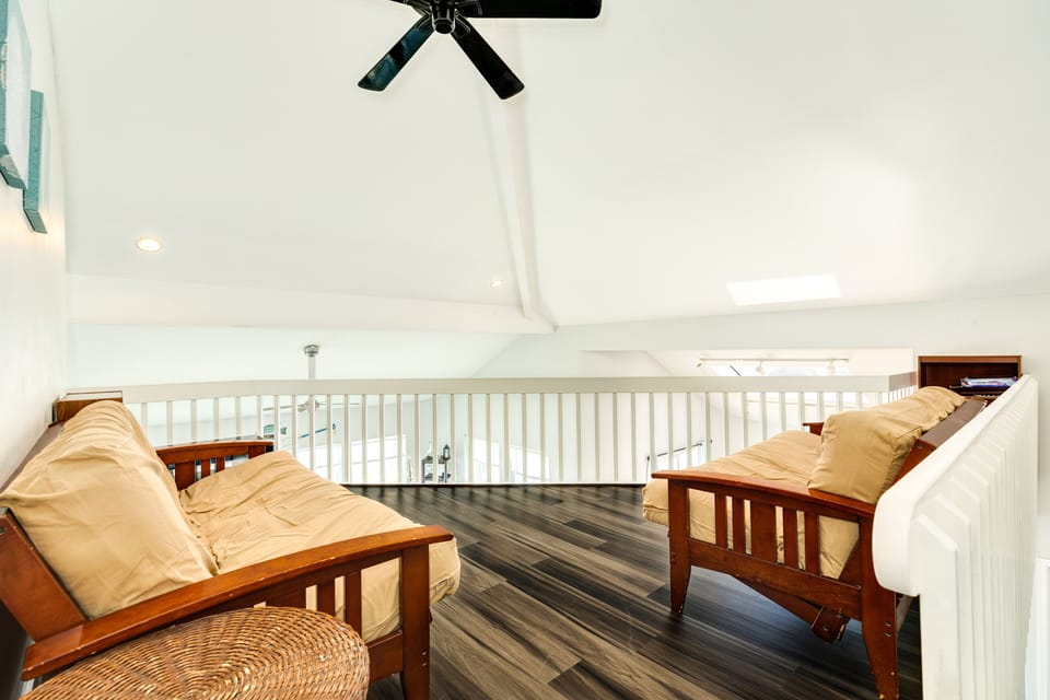 Upper level loft with two futons overlooks the living area