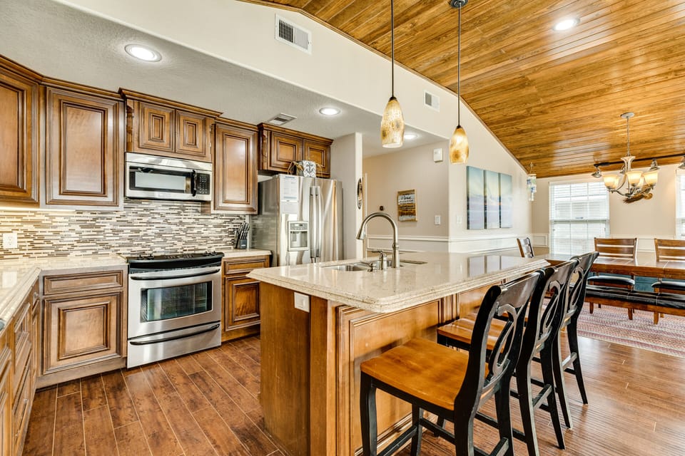 Fully equipped kitchen with stainless steel appliances and plenty of storage