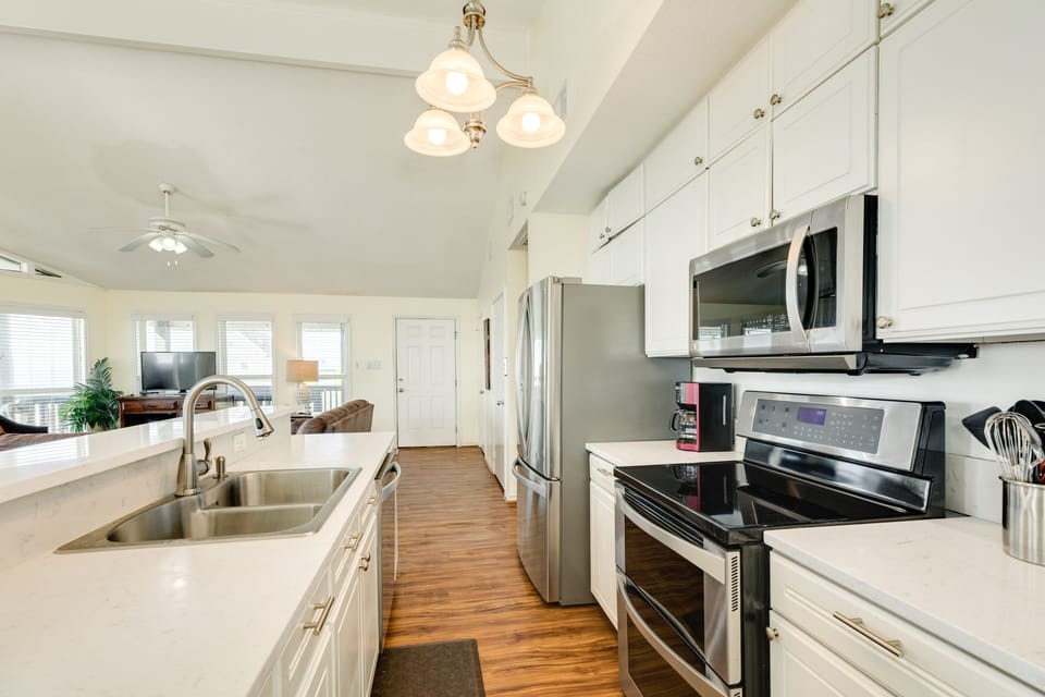 Fully equipped kitchen includes stainless steel appliances