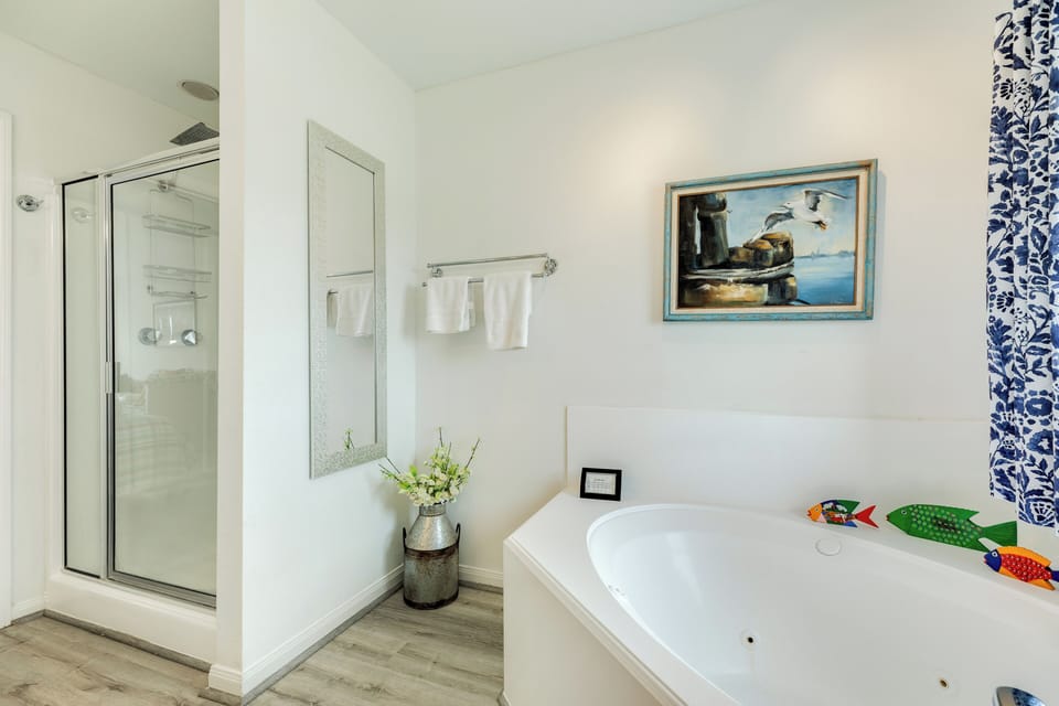 Large soaking tub and separate shower in the upper level bathroom