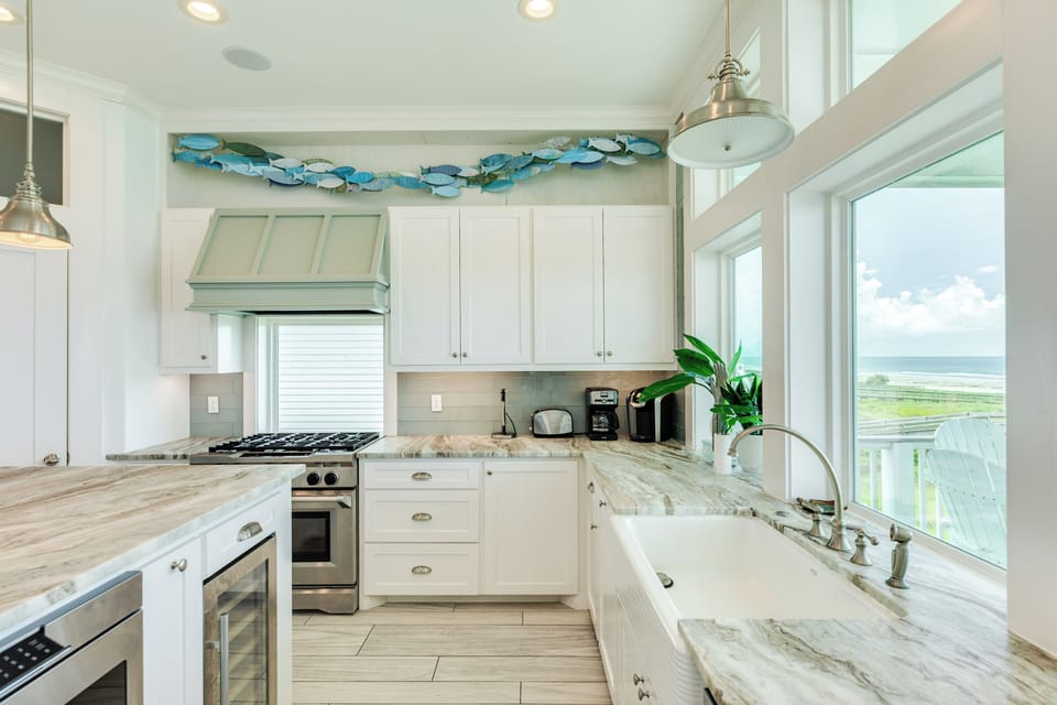 Enjoy beachfront views while cooking and cleaning