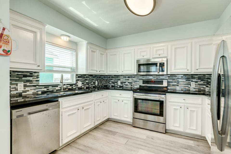 Fully equipped kitchen includes stainless steel appliances