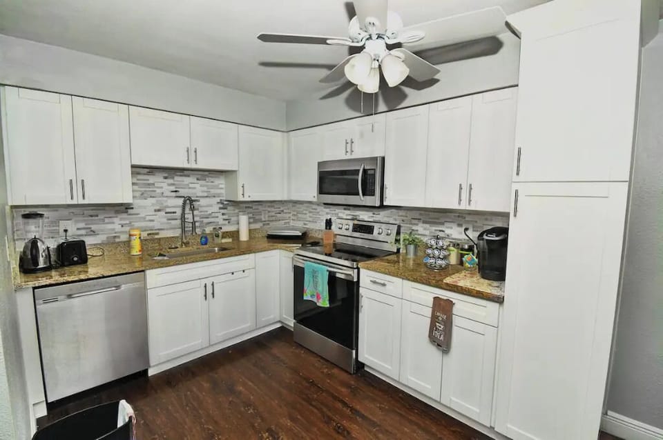 Full renovated kitchen with granite countertops, utensils, toaster, Keurig, etc…