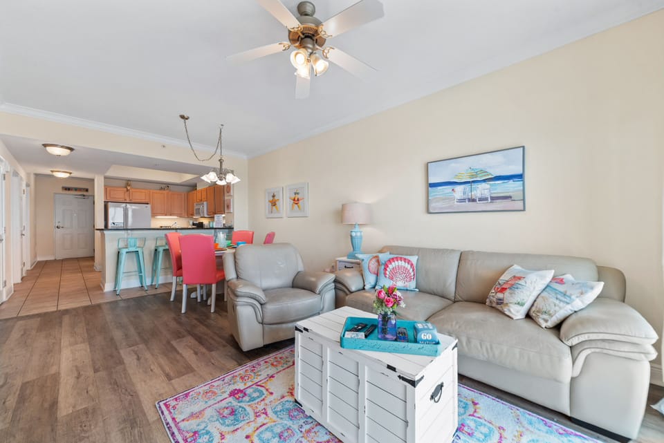 Living Room with Sleeper Sofa - The combination of natural materials, subtle coastal accents, and abundant natural light creates a warm and welcoming ambiance.