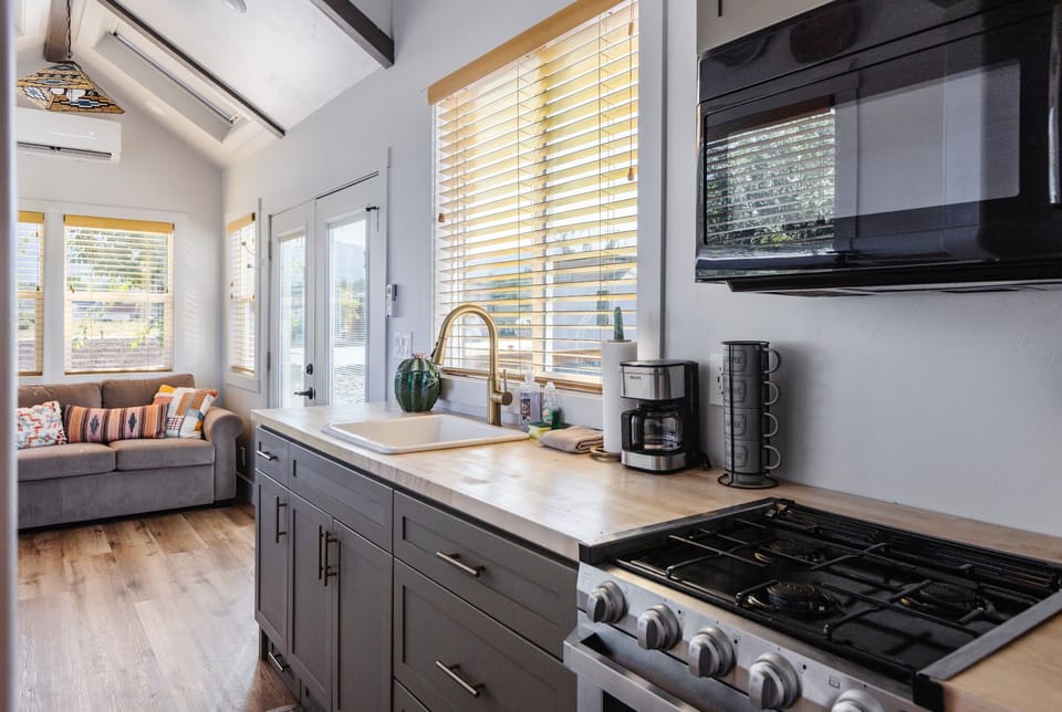 Well-equipped kitchen with gas range, sink, coffee maker, and generous counter space for preparing meals during your Southern Utah getaway.