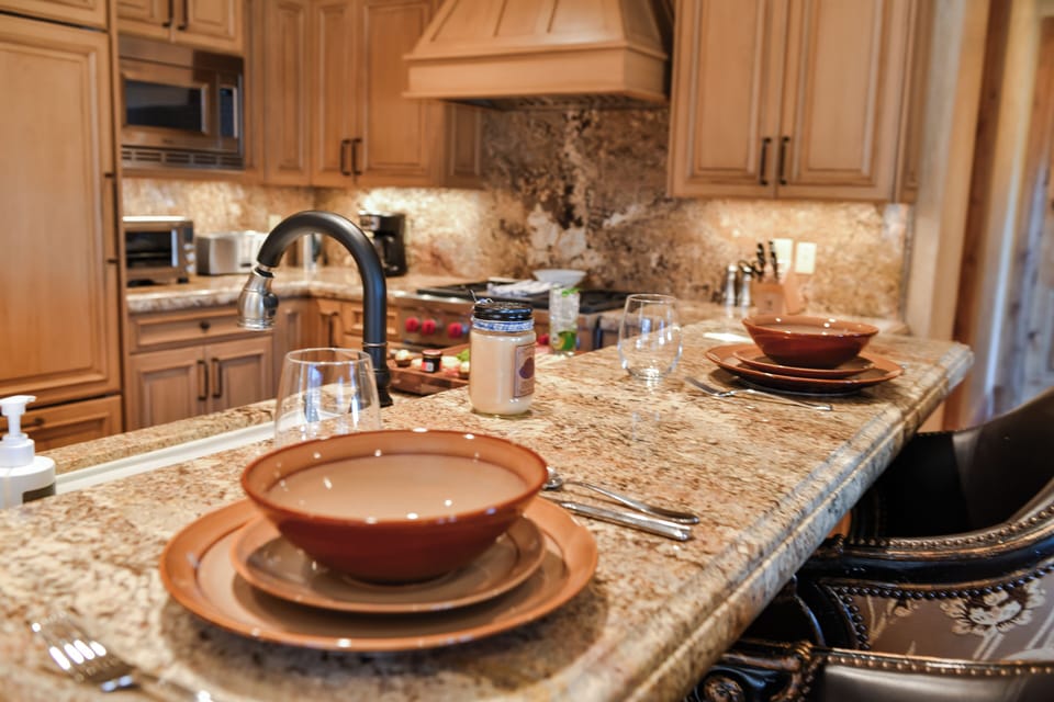 The spacious breakfast bar provides additional seating and an ideal space for casual dining or morning coffee.