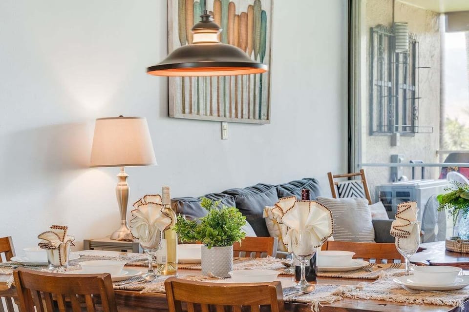 Charming dining nook with coastal accents and warm lighting for intimate gatherings.