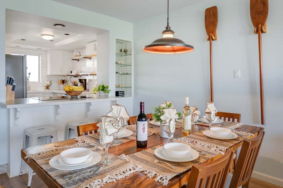 Bright dining space with tropical décor and easy access to the kitchen for convenient entertaining.
