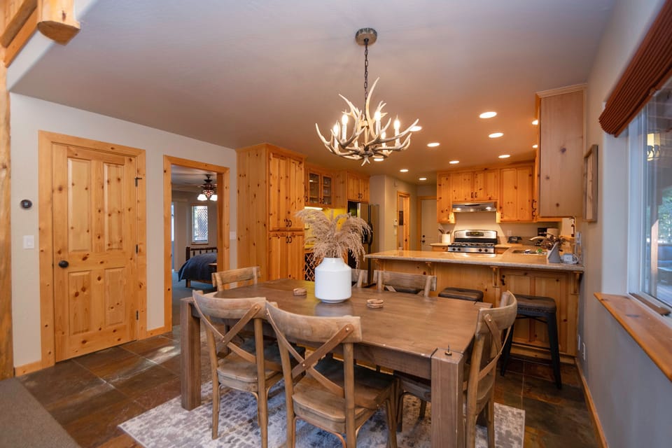 Dining Table for 6 with 3 additional barstools on the kitchen peninsula. 