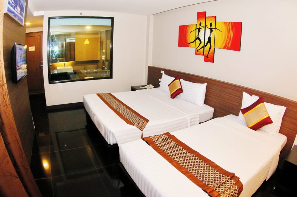 Deluxe Triple Room, Balcony, Garden View | Hypo-allergenic bedding, minibar, in-room safe, desk