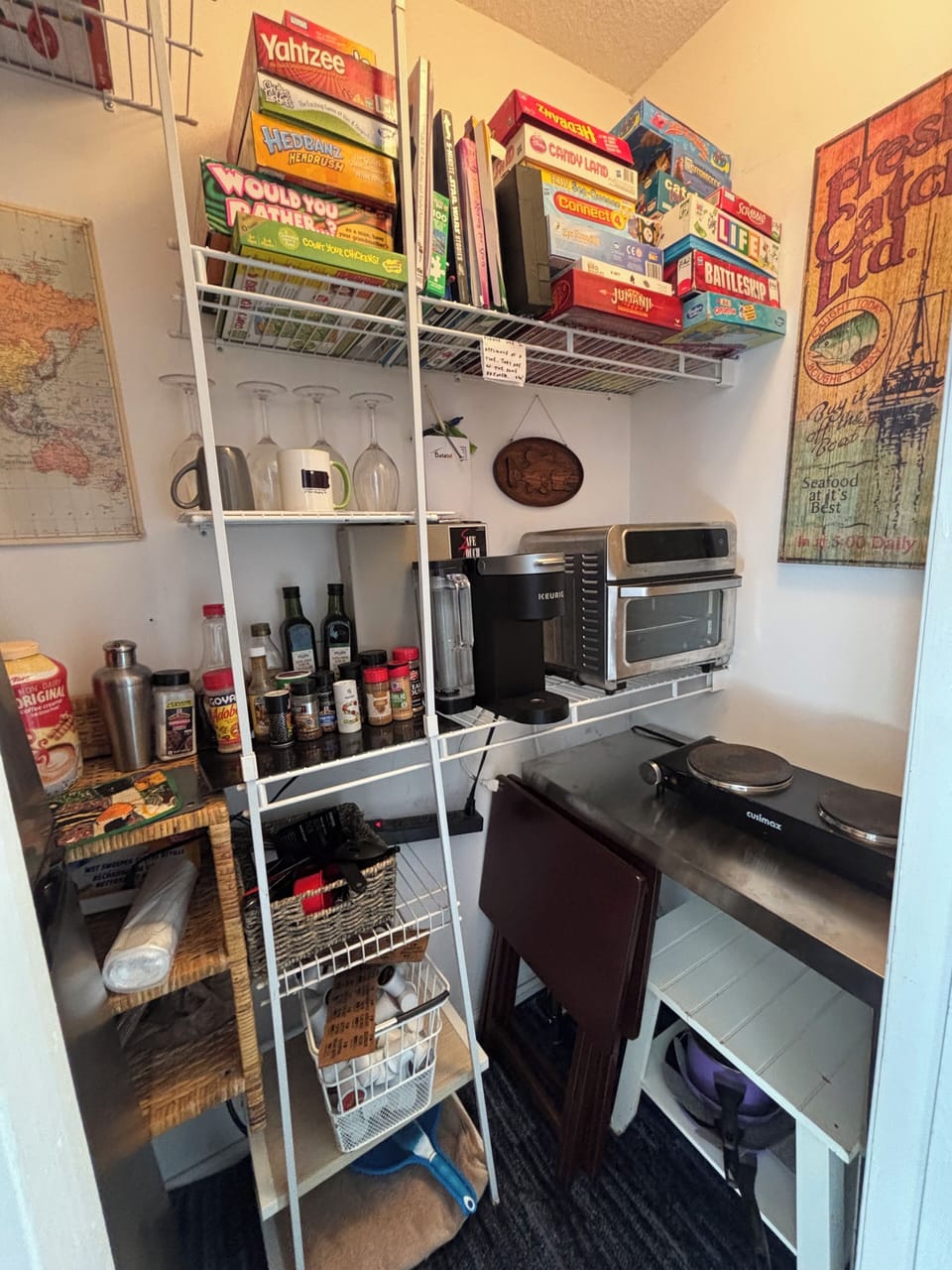 Utility prep table, cooktop, pizza oven, Kuerig, spices, games, tables, cookware