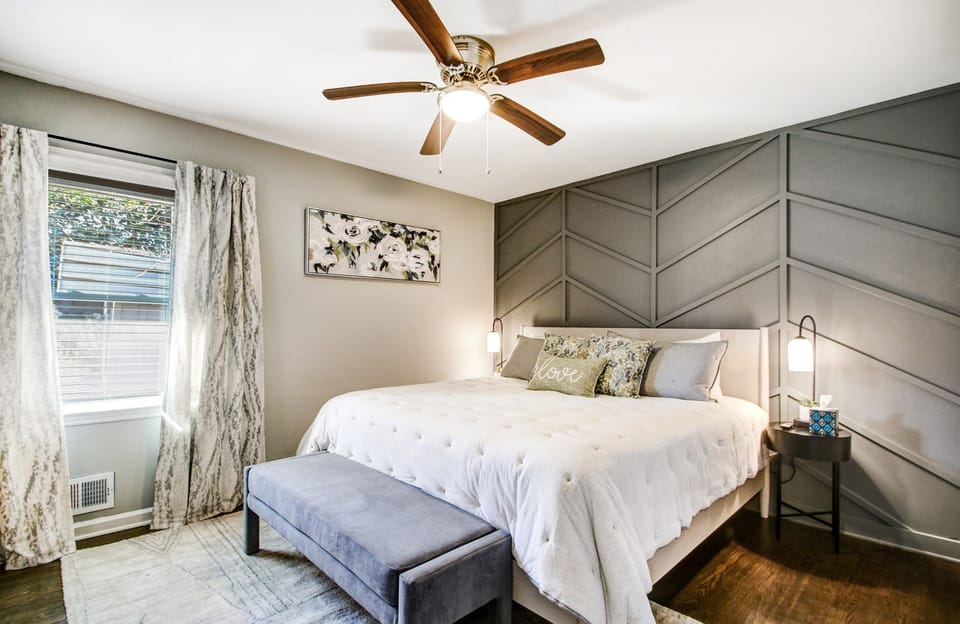 Sleep in on the king bed with the ceiling fan humming. Room-darkening shades and fresh linens make late mornings easy.
