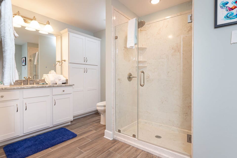Refresh yourself in the spacious walk-in shower in the guest bath, enjoying the soothing vibe after a day on the coast