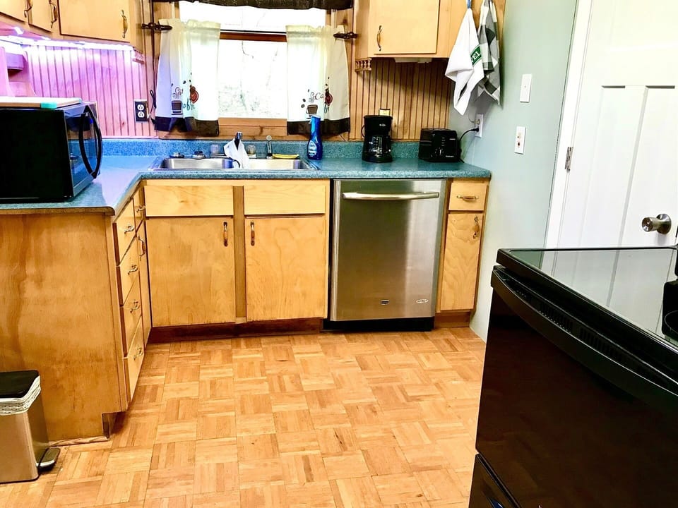 Kitchen with microwave, stove/oven, dishwasher, coffee maker and all utensils
