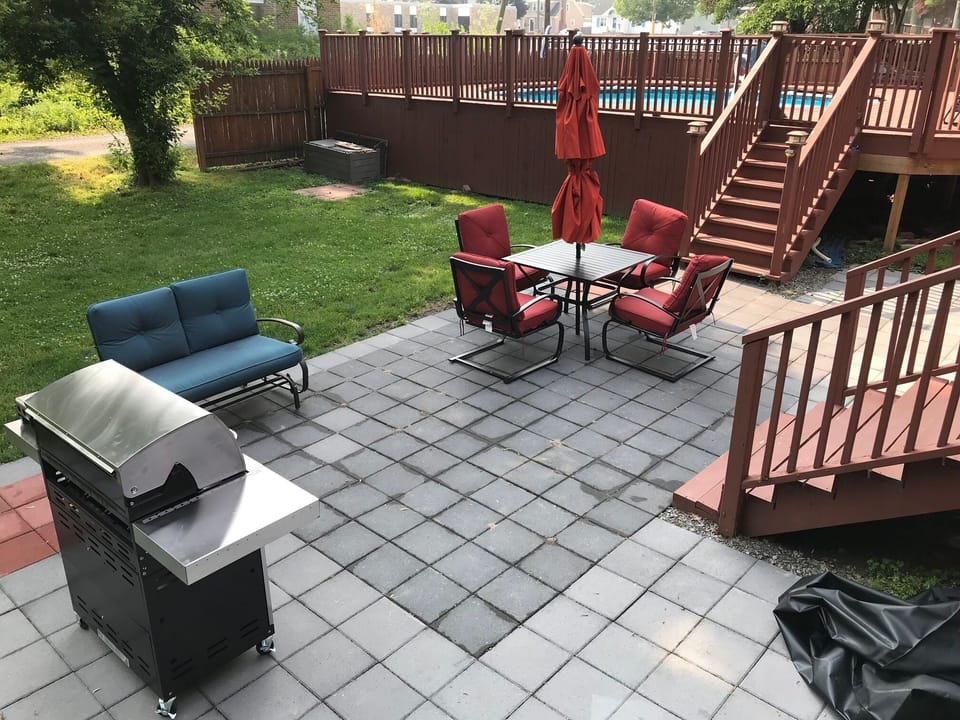 College Street patio with guests' gas grill and outdoor dining table for #517
