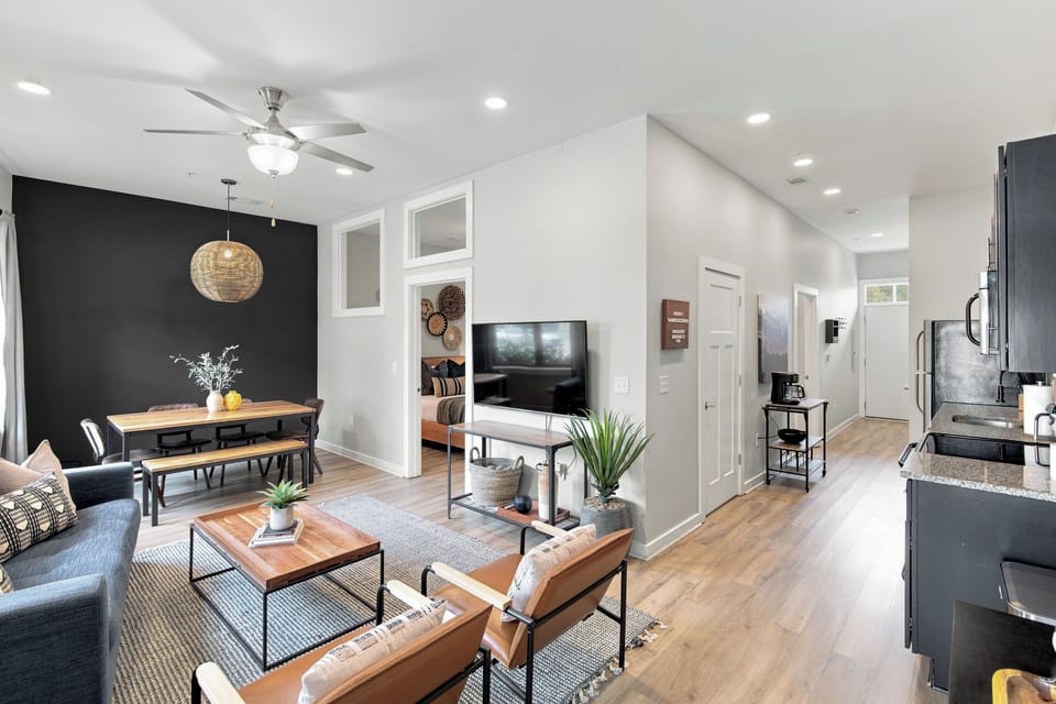 Large living room with Queen pullout couch, dining table with seating for 6.