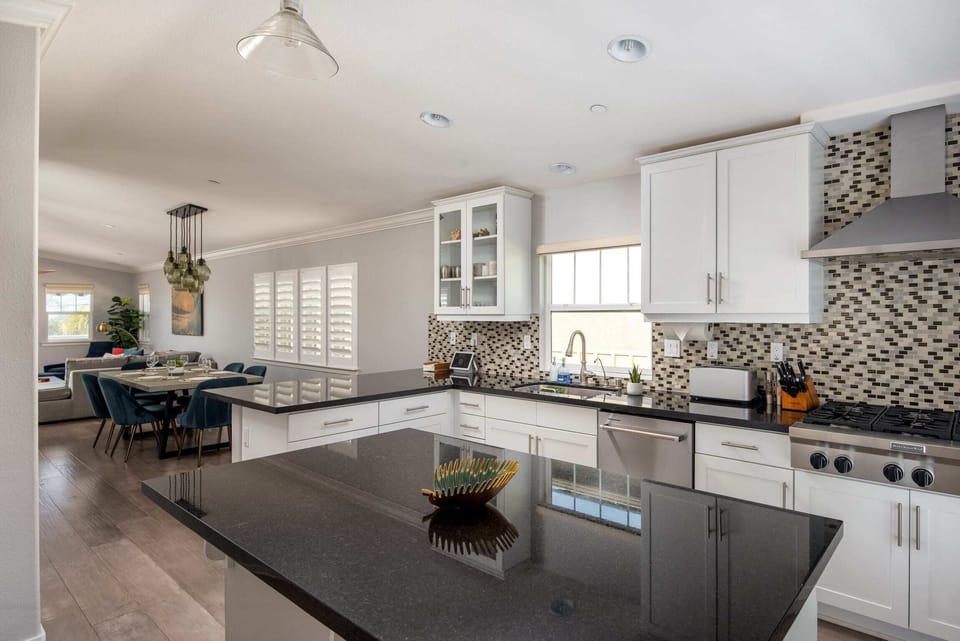 The modern kitchen is equipped with high-end appliances and all the tools you need prepare a delicious home-cooked meal.