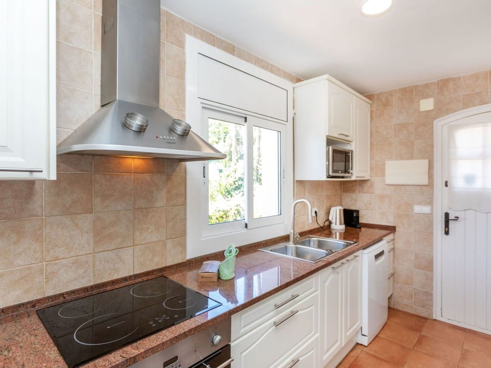 Kitchen, Countertop, Cabinetry, Kitchen Appliance, Major Appliance, Flooring, Furniture, Wood, Interior Design, Home