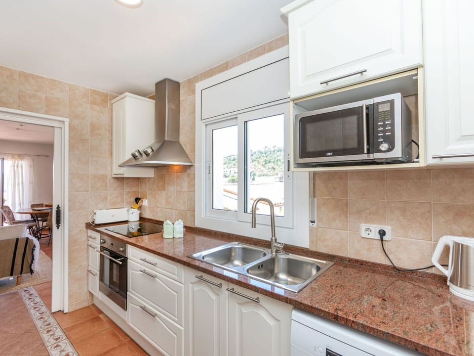 Kitchen, Countertop, Kitchen Appliance, Cabinetry, Major Appliance, Furniture, Flooring, Wood, Kitchen Sink, Interior Design