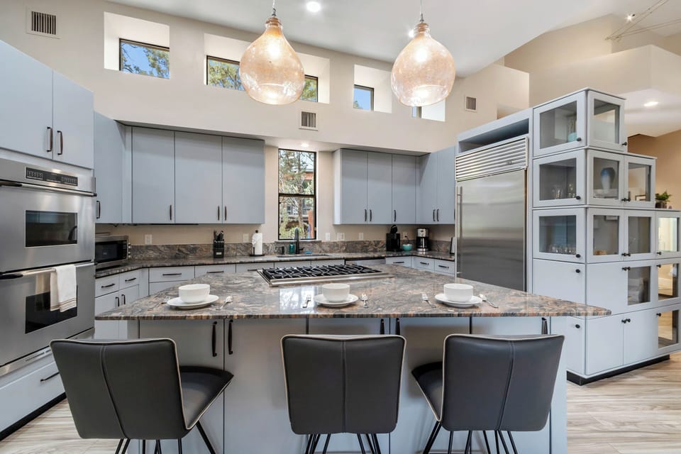 Well stocked kitchen with Island seating for three.