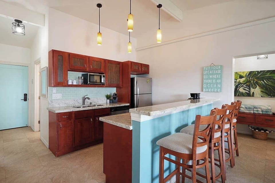 Fully stocked kitchen with bar seating