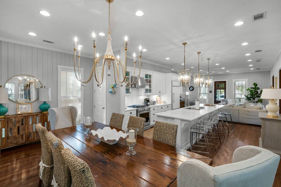 Open-concept family room, dining, and kitchen area that stretches throughout the bottom floor of the home