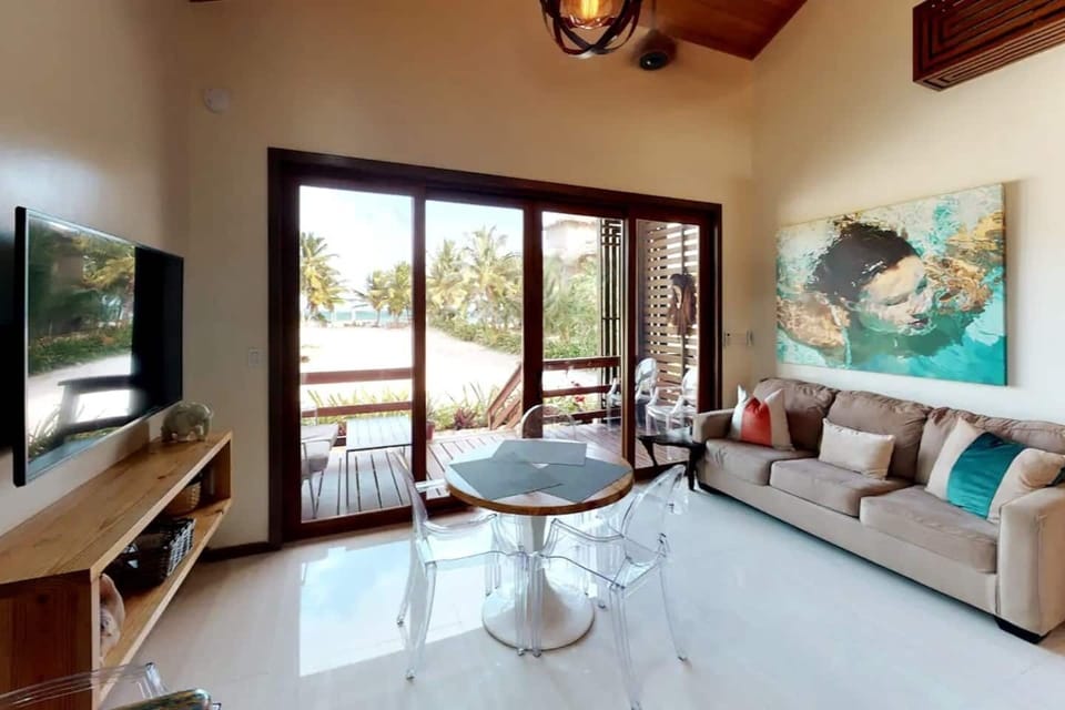 Relax in the inviting living room adorned with plush furnishings, creating a cozy haven for unwinding after a day of exploration. This living room includes a queen size sofa bed.