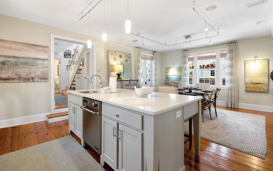Your spacious kitchen features a gleaming marble island and modern appliances, perfect for preparing memorable meals during your stay.