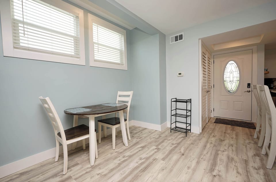 Enjoy meals in your bright dining space with natural light streaming through windows and stylish seating for comfortable gatherings.