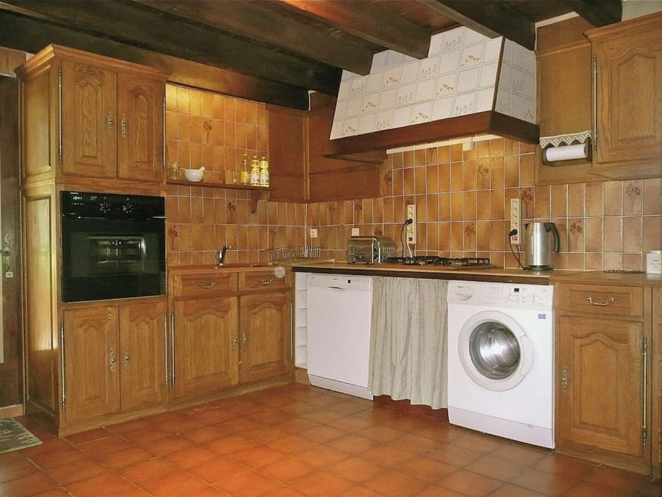 Kitchen leading onto the covered terrace at the back
