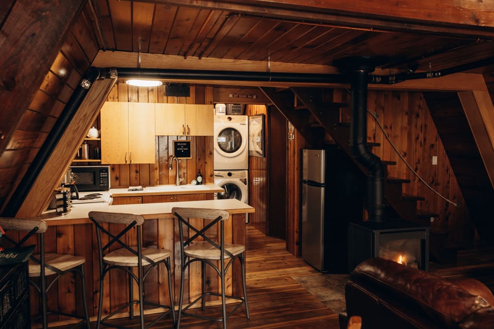 Fully stocked kitchen with stove, fridge, microwave, and all the essentials.