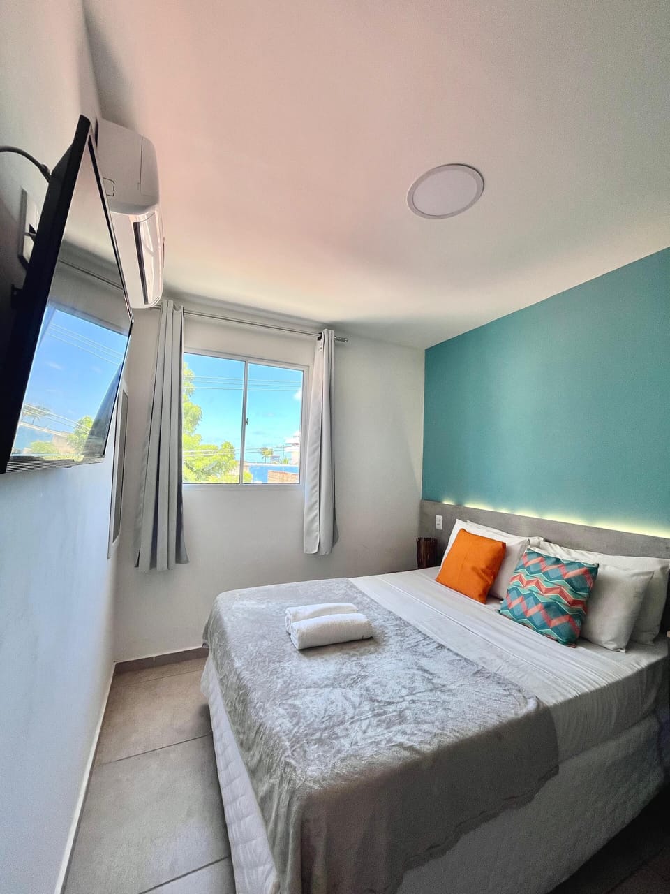 Desk, laptop workspace, bed sheets
