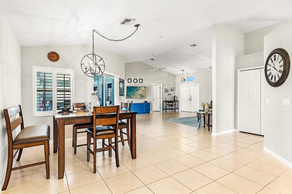 The dining area sits between the living room & kitchen