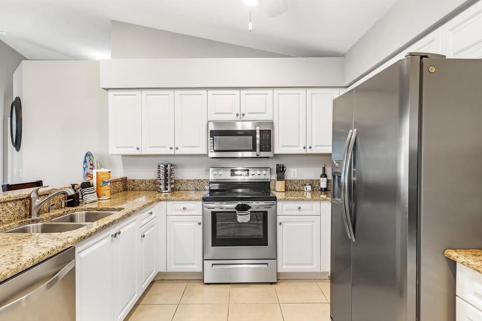 The kitchen has stainless steel appliances
