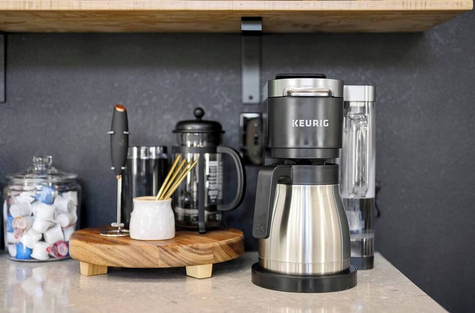Coffee/tea lovers' Station: Keurig K Duo Plus Machine for ground coffee & K-Cup, Nespresso Machine, French Press, Coffee Grinder, Frother, Coffee/tea spoons. Also included: Public Goods Ground Coffee, Donut Shop Medium Roast K-cups, creamer & sugar.