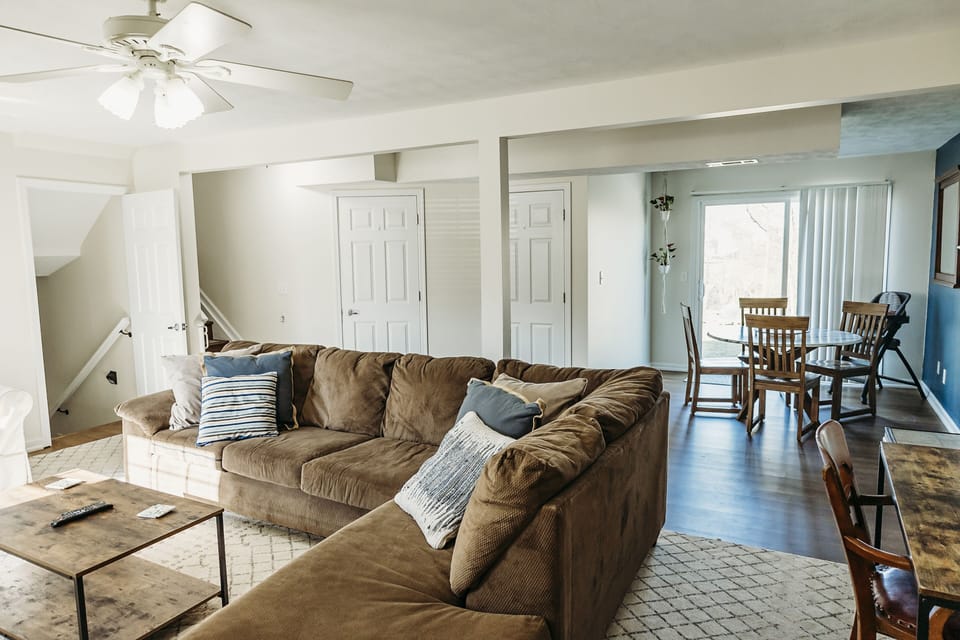 One of two living spaces in the home. This one boasts a 65" Smart TV.