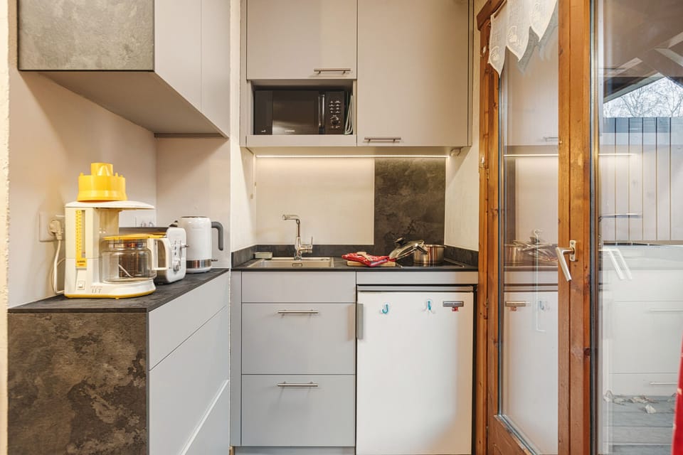 Practical kitchen next to the balcony access