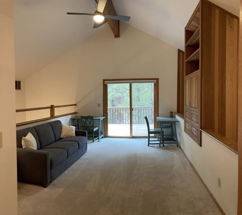 The loft with its own QLED tv, private deck & bathroom. Can be 5th bedroom.