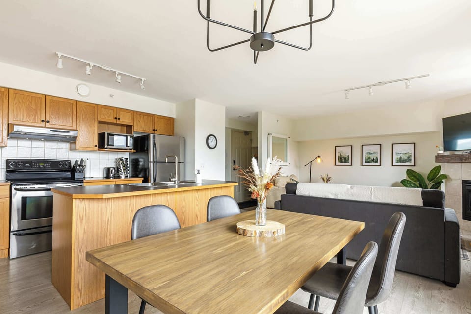 Open-concept kitchen, dining and living area.