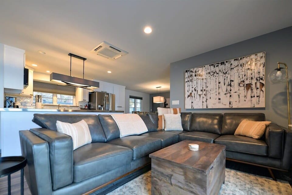 Sink into plush leather seating where your open-concept living flows into a sleek kitchen, perfect for unwinding after exploring.