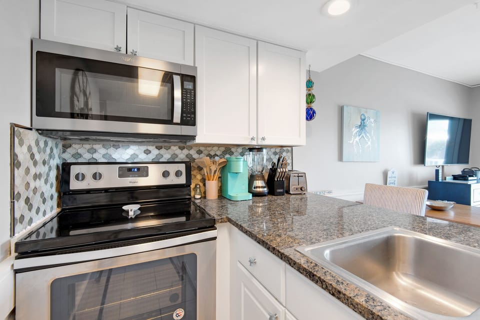 Stainless Appliances and Lovely Tilework
