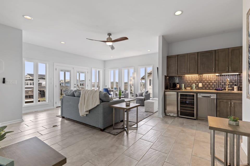 Second floor living room with amazing views of the salt marsh, queen sleep couch and adult wine/coffee/espresso bar.  Two (2) bedrooms on this level.