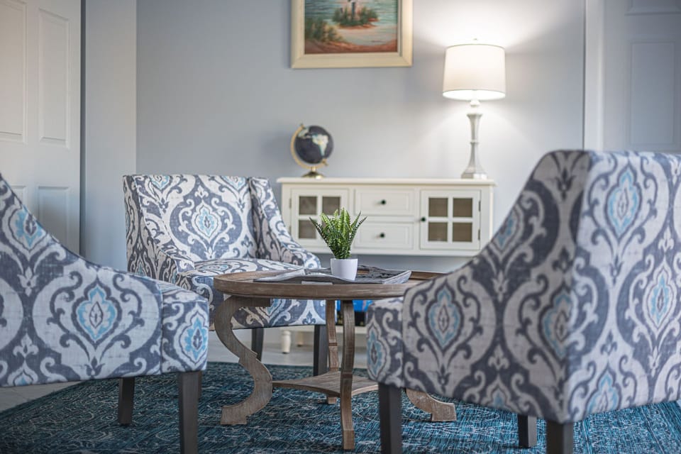 Pool Living room round table looking out over the pool
