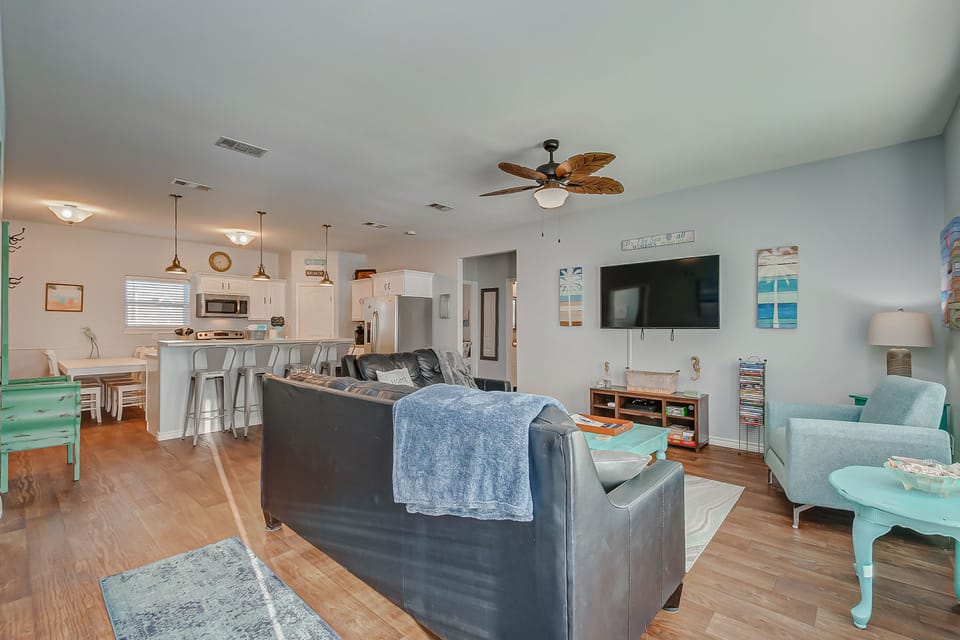 Cozy living room with board games, Xbox, and large smart TV.